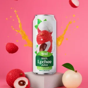 A can of Vinut 100% Lychee Juice is displayed on a pedestal with whole and cut lychees around it and juice splashing in the background against a pink backdrop.